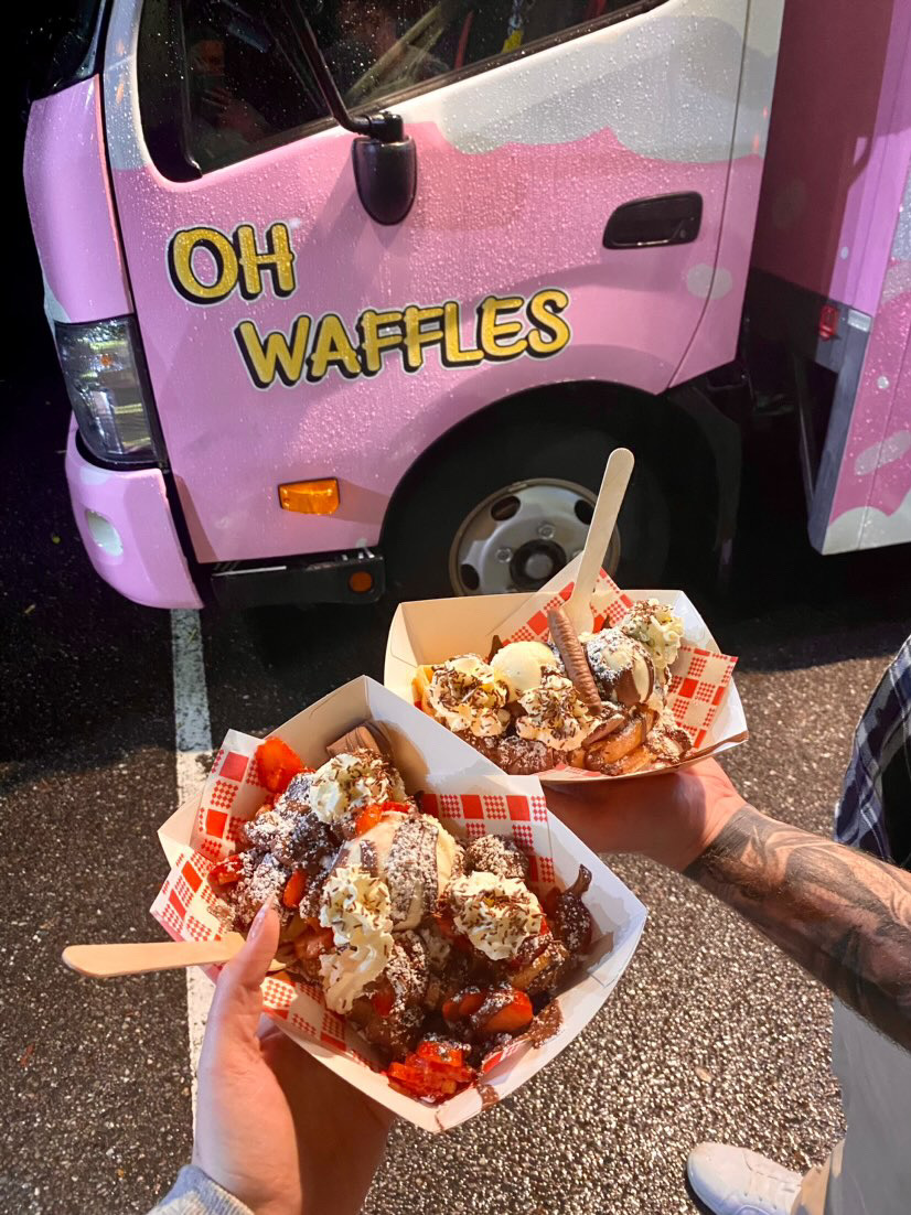 Oh Waffles food held up in front of truck